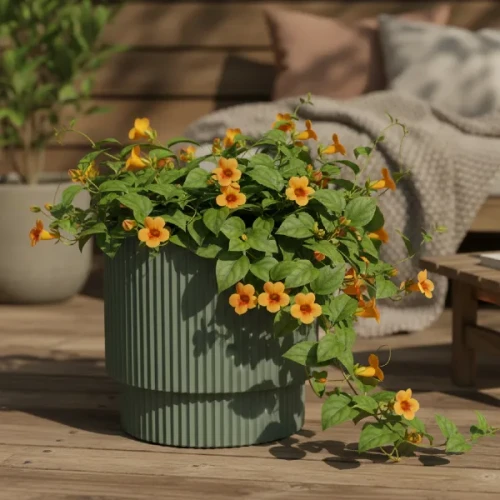 Doniczka Milly Prosperplast 30cm w kolorze zielona pinia stojąca na tarasie