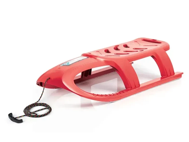 Czerwone sanki plastikowe o sportowym designie Prosperplast Bullet o długości 102 cm z linką transportową.