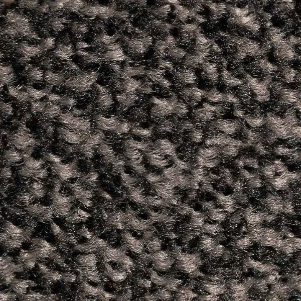 Detale warstwy tekstylnej wycieraczki obiektowej Strongmata ukazujące ciasny splot czarnych i brązowych włókien High-Twist Nylon o strukturze szczotki.